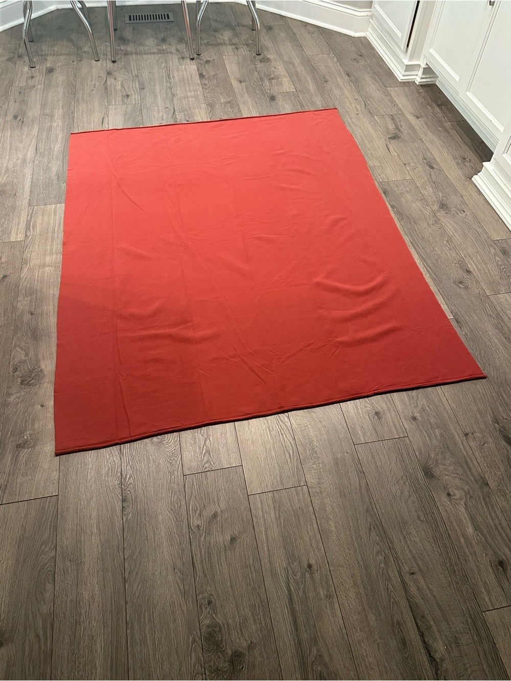 Fleece material, burnt red in color
